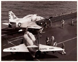 Flight deck crews move two A-4 Skyhawks - US Navy photo, cleared for publication.